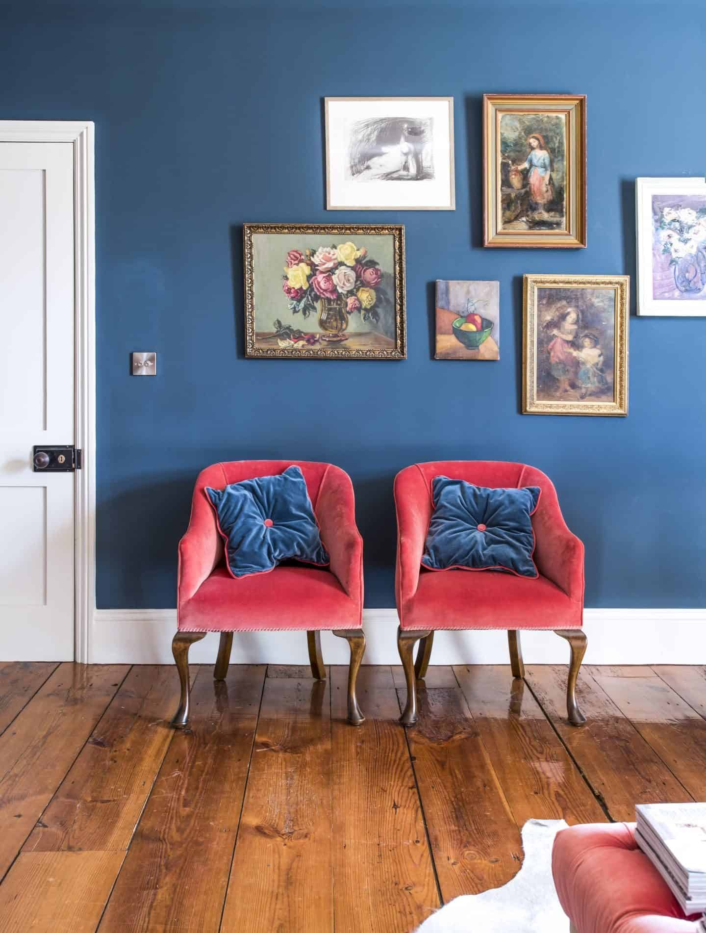 Image from the book Love Colour ©annastarmer - A blue wall with red chairs in front