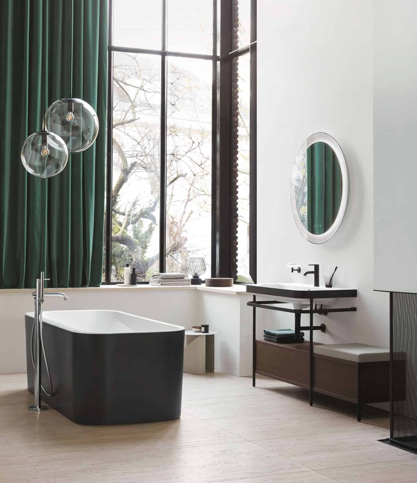 Duravit Happy D.2 Plus C-Shaped bathroom range. Free-standing bathtub with matt black exterior and sink console with a seat and extra storage.