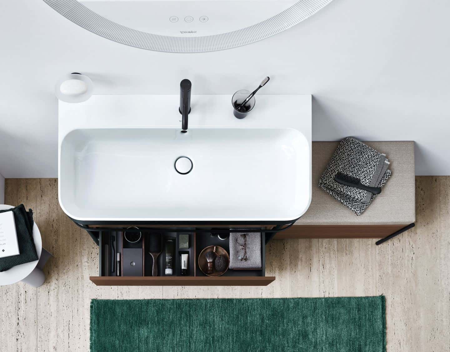 Duravit Happy D.2 Plus C-Shaped bathroom range. Sink console with a seat and extra storage.