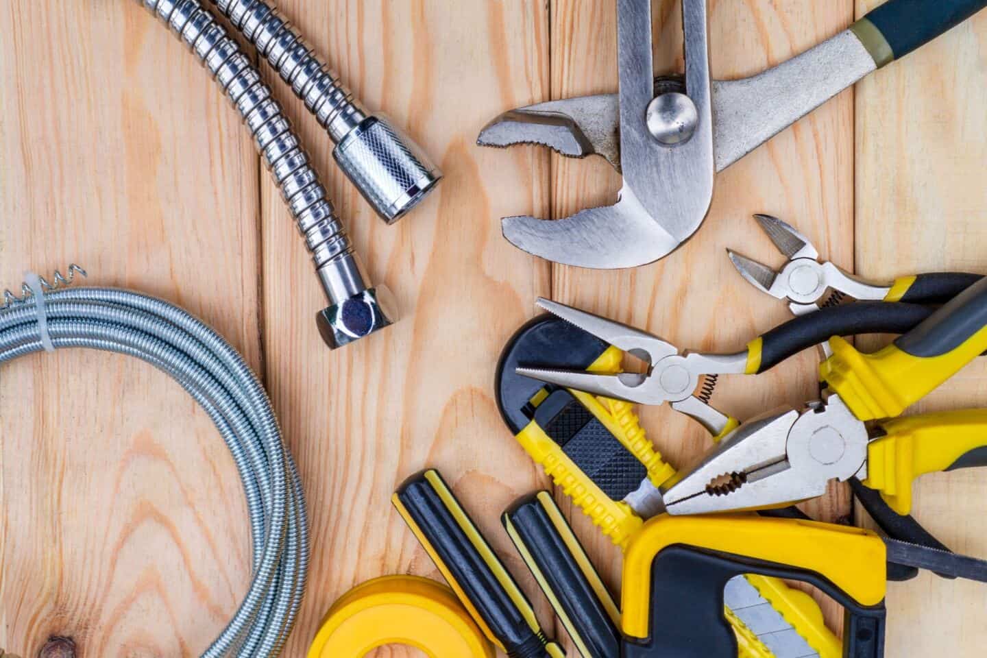 Plumbing tools and equipment in a wooden floor