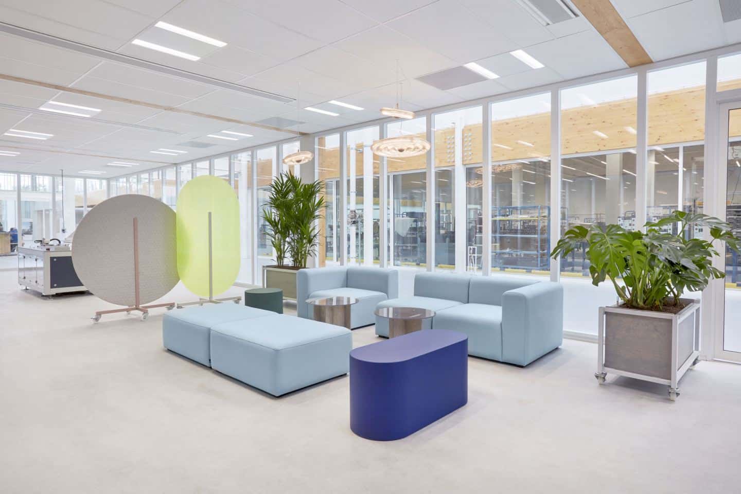 Protective Office Screens for the post-pandemic workplace by Dutch Invertuals used in a lobby seating area