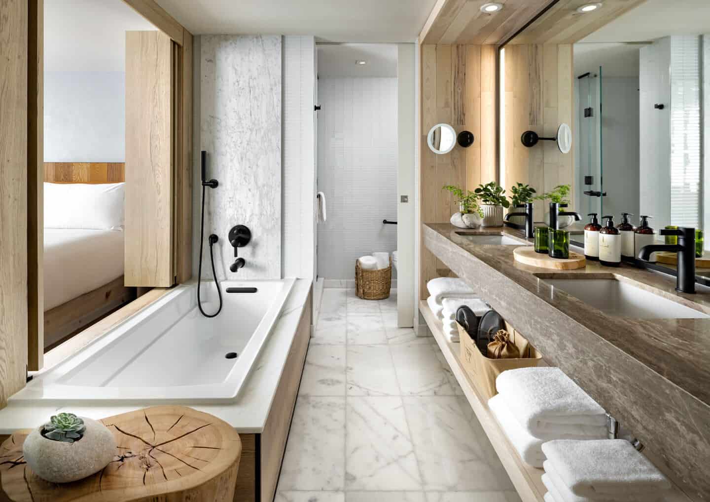 A minimalist bathroom containing lots of wooden accents