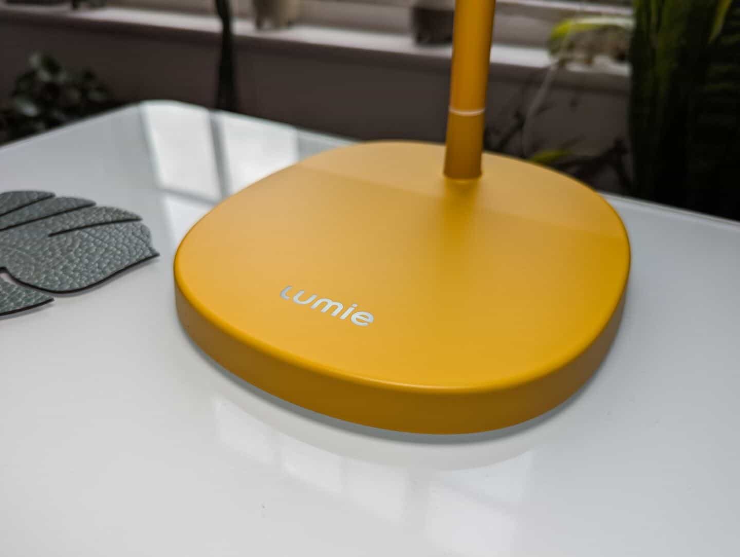 The base of the Lumie task lamp features a logo which doubles up as a capacitive slider mechanism to operate the lamp