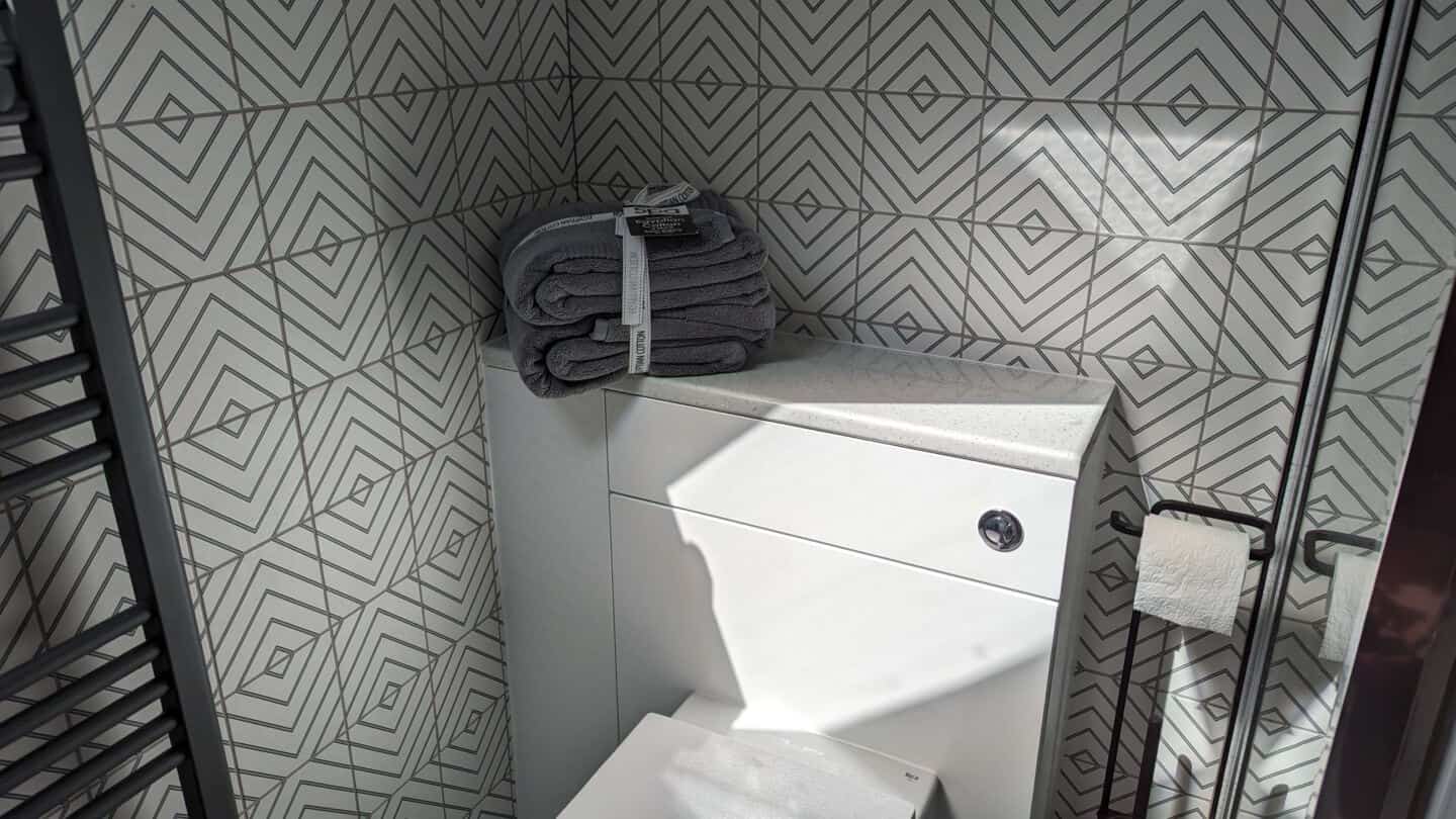 Grey Egyptian Cotton Bath Towel Bale on a toilet unit in a bathroom