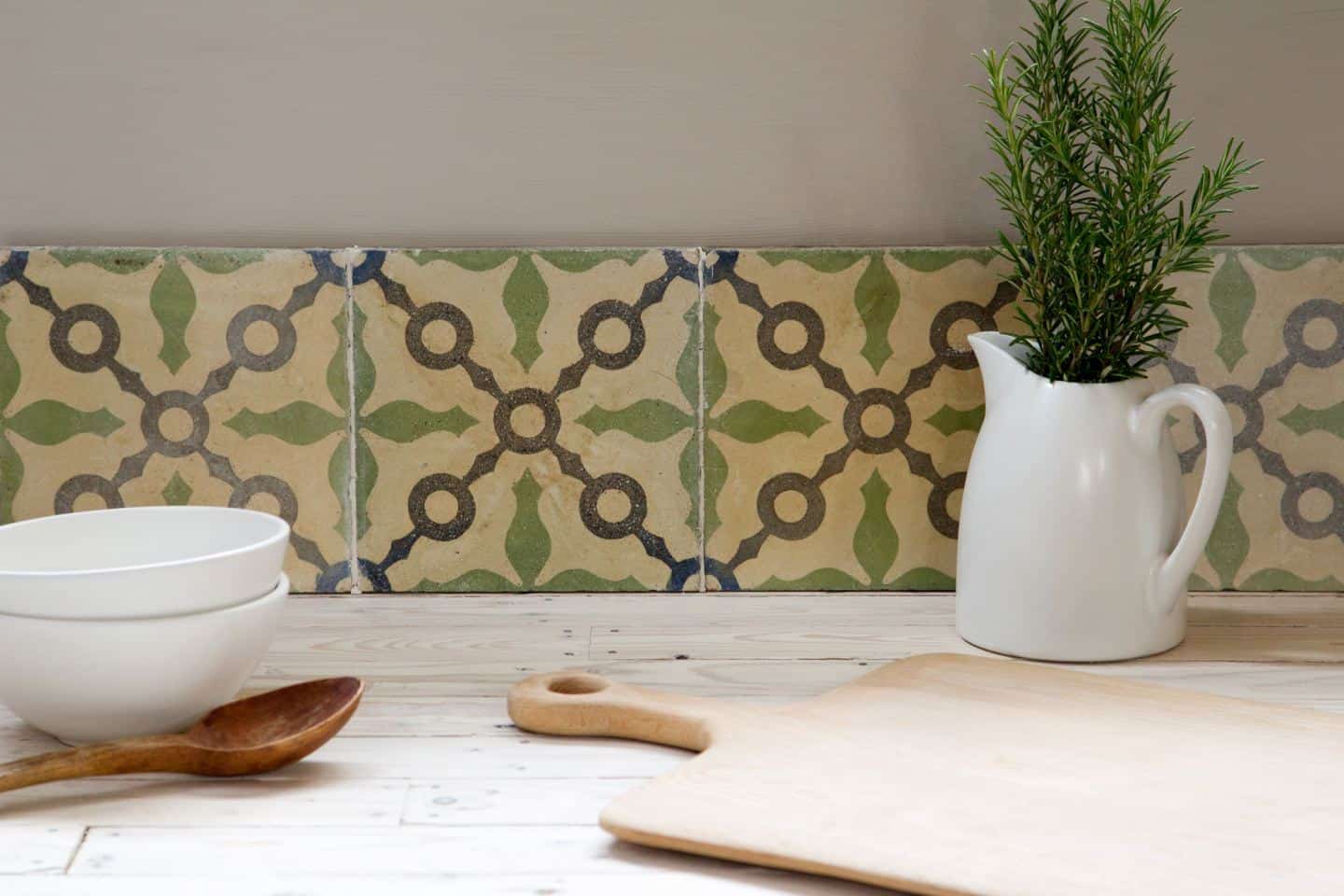 Reclaimed or antique tiles used as a kitchen splashback -Maitland & Poate