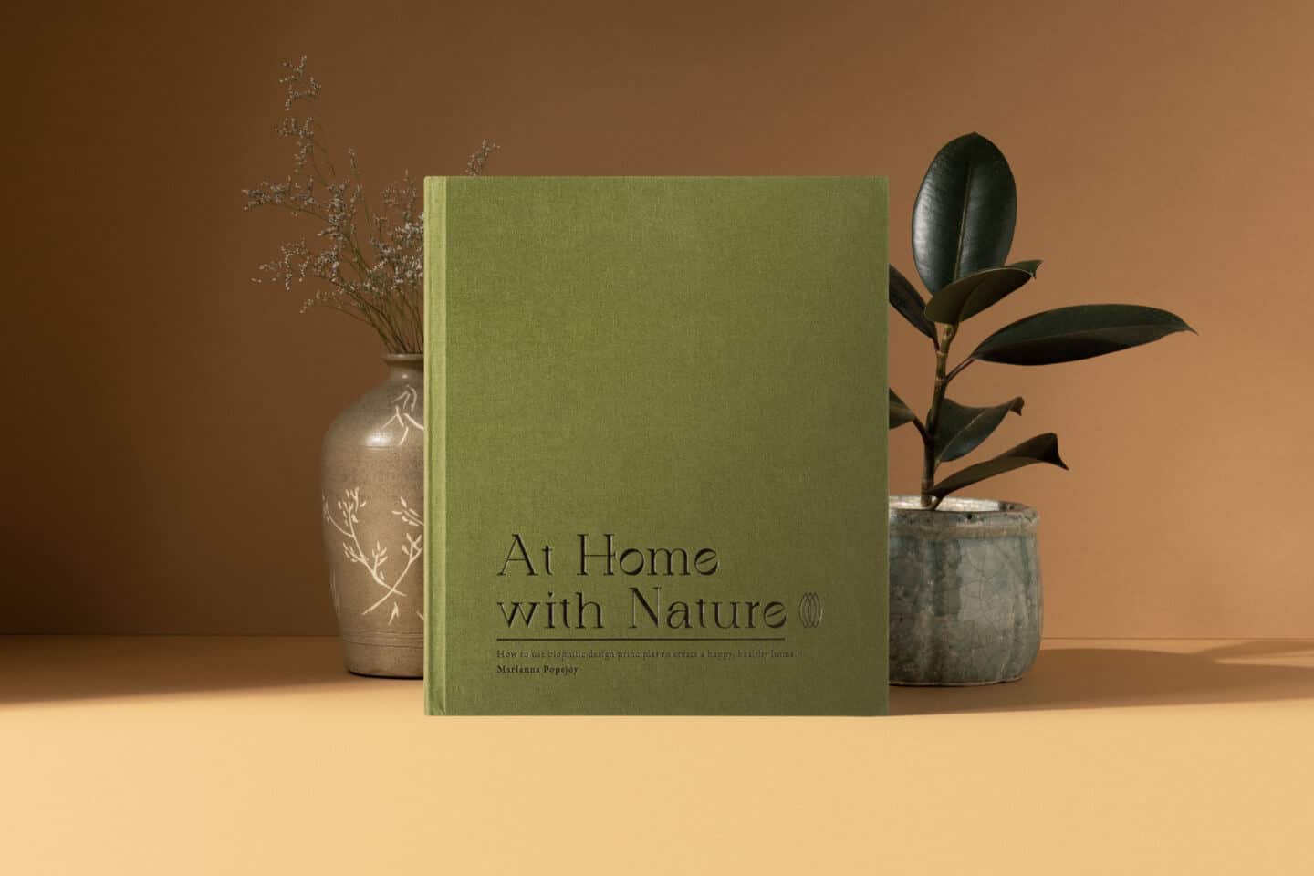 The biophilic design book 'At Home With Nature' by Marianna Popejoy.