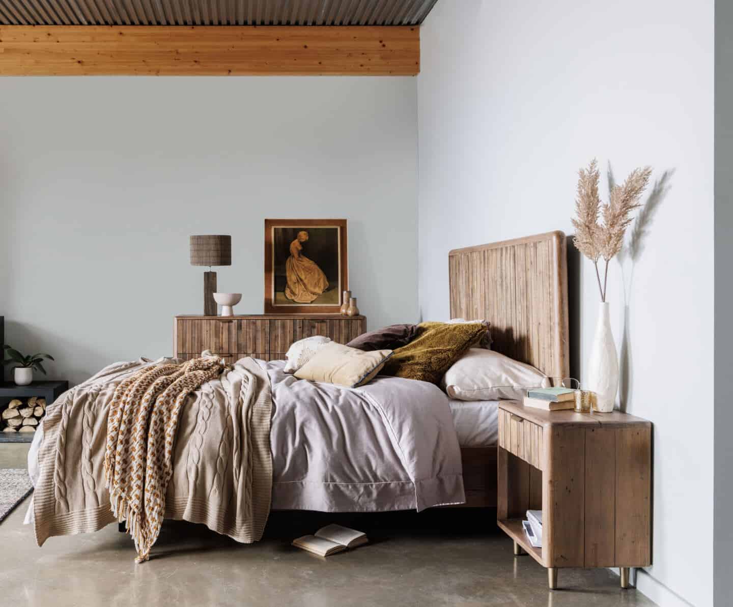 Bedroom featuring earthy neutral colours, wooden furniture and lots of natural materials and textures