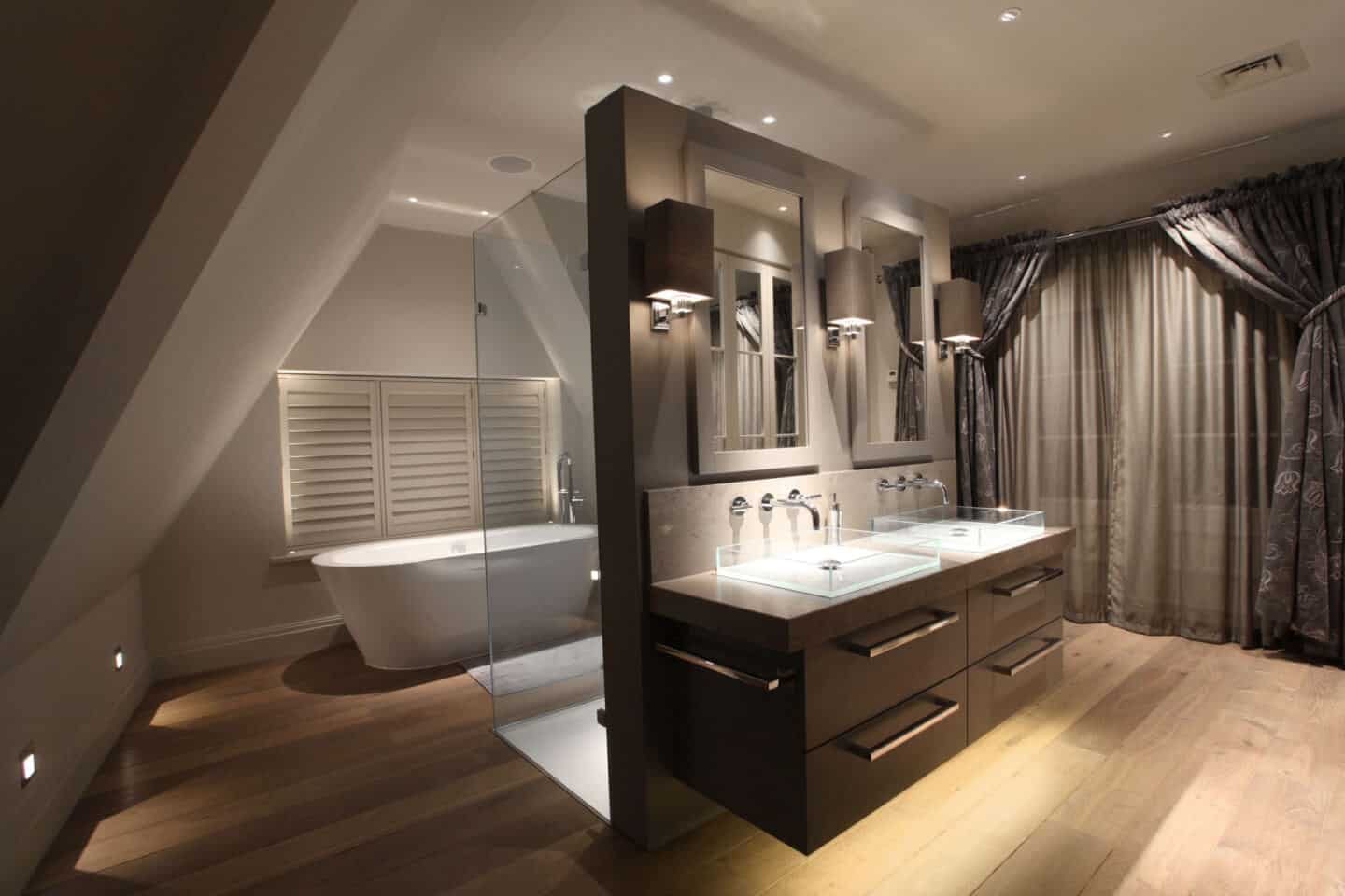 A bathroom with free-standing bathtub and freestanding vanity partition wall