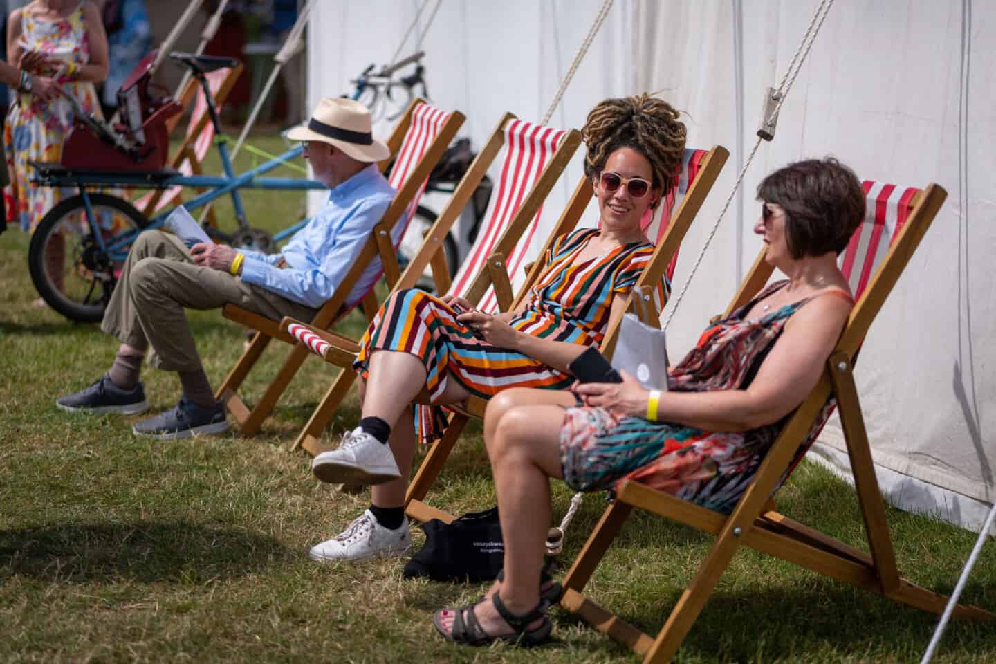 two women and a man sit in deck chairs at The Craft Festival