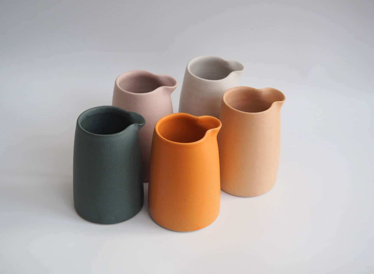 Ceramic jugs in pastel shades by Bethan Jones