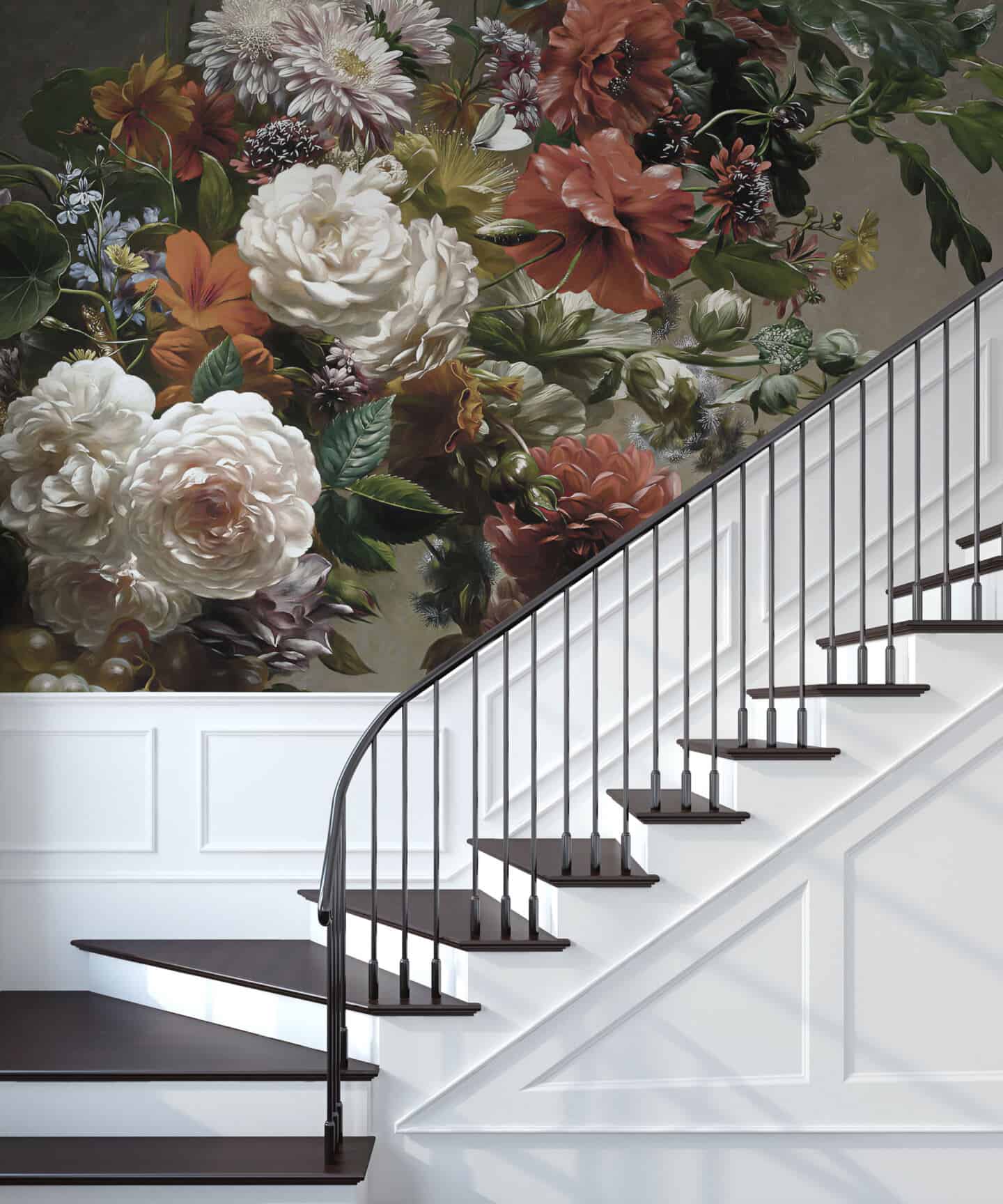 Bold floral wallpaper runs up the wall beside the stairs 