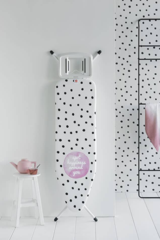 Spotty Brabantia Ironing Board leaning up against the wall