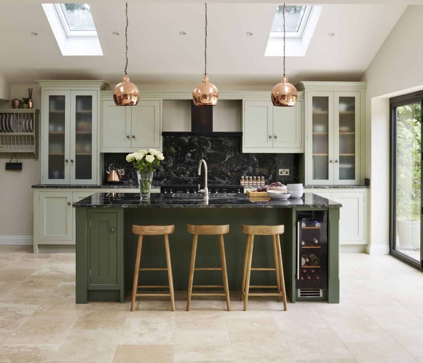 This Canterbury inspired kitchen by Davonport is hand-painted using Mizzle and Green Smoke, both Farrow & Ball, to introduce an organic, natural feel to the space. 