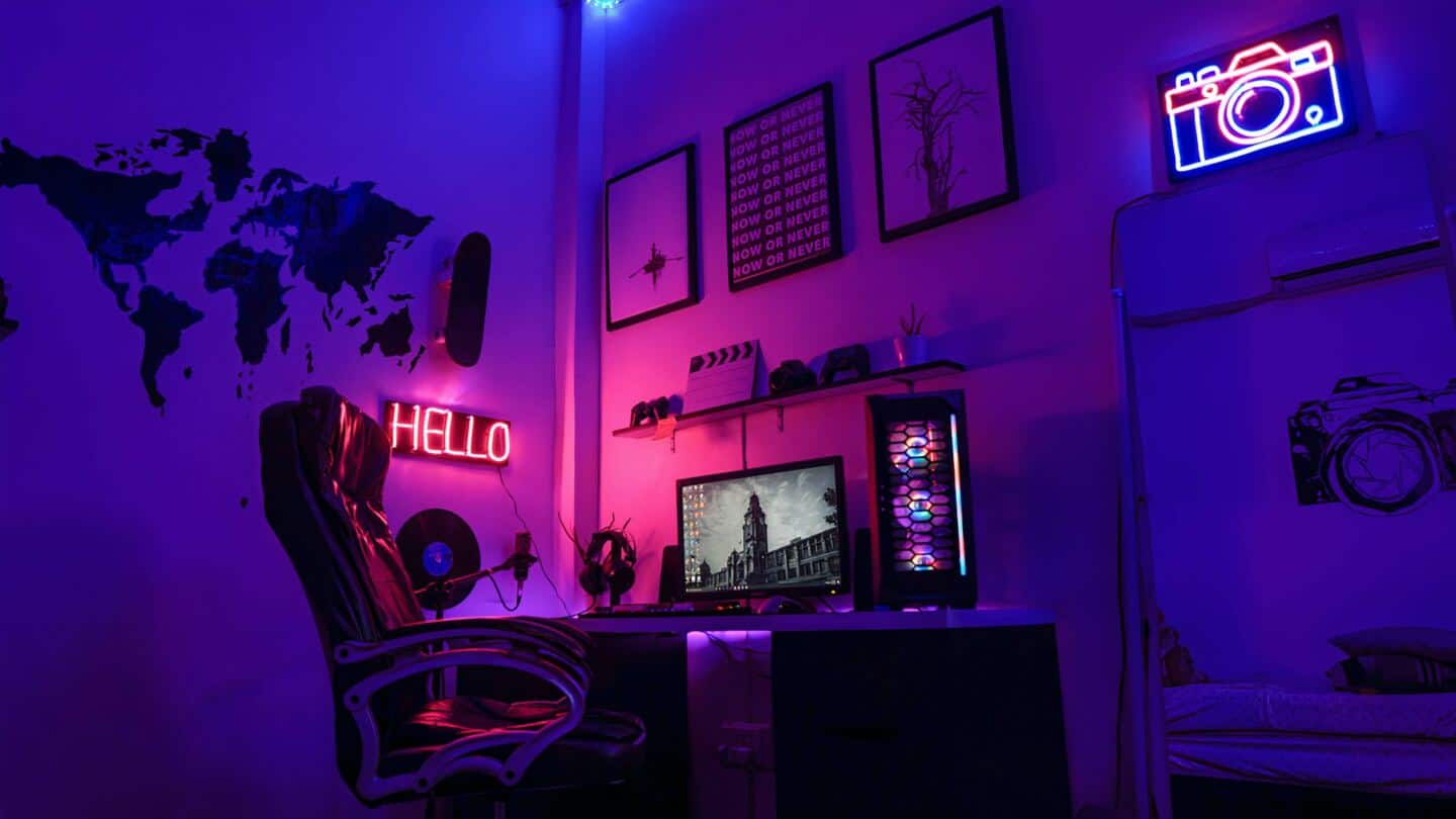 Home gaming setup with LED lights in pink, purple and blue