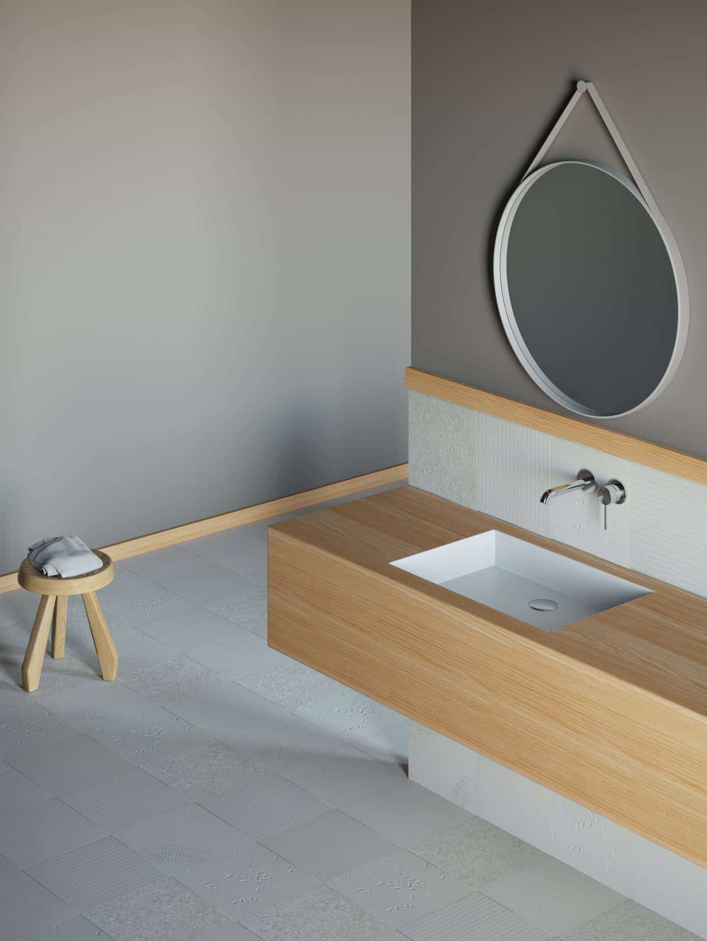 A bathroom with grey walls, white tiles and a wooden vanity.