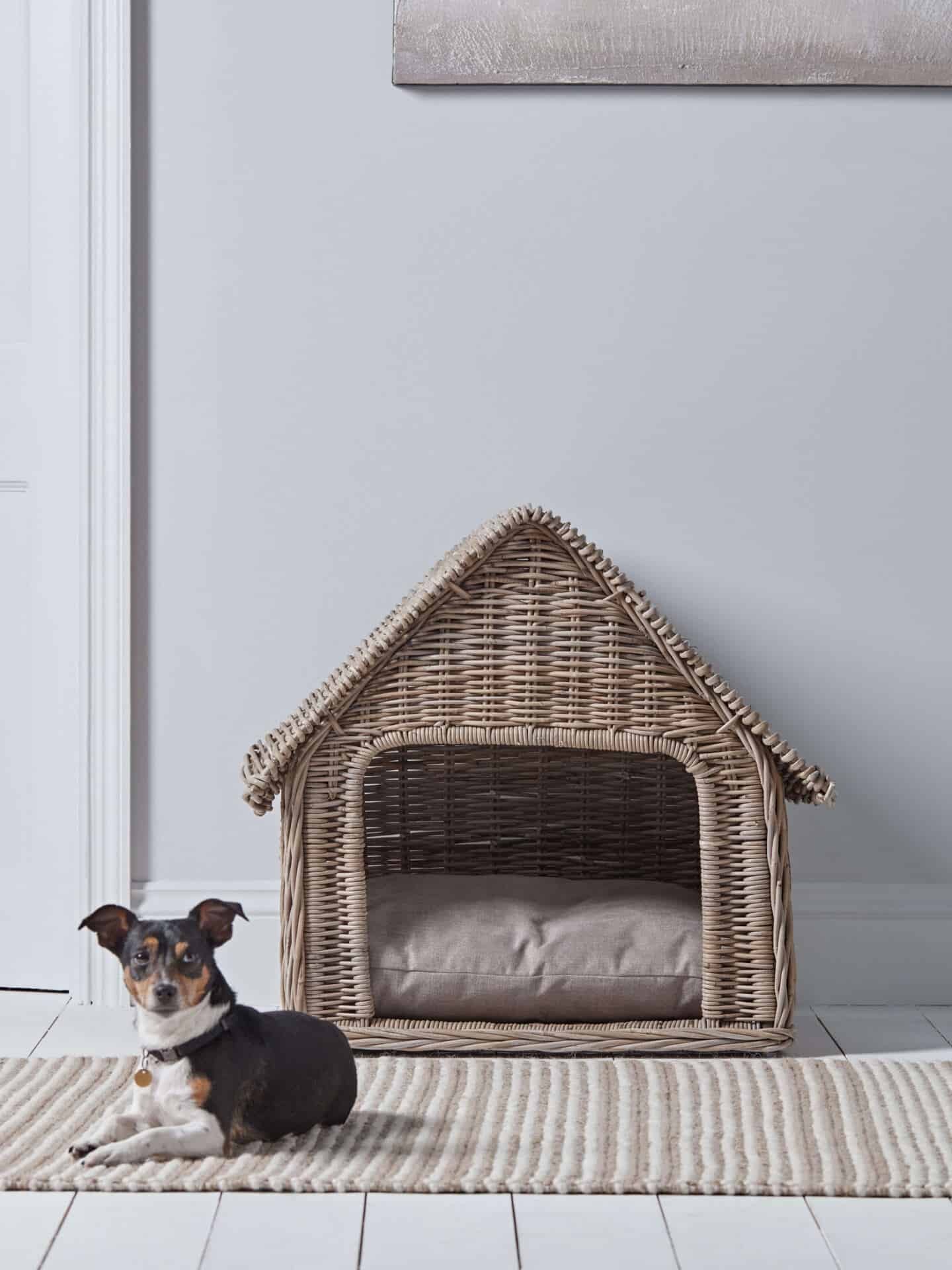 A rattan dog house from Cox & Cox