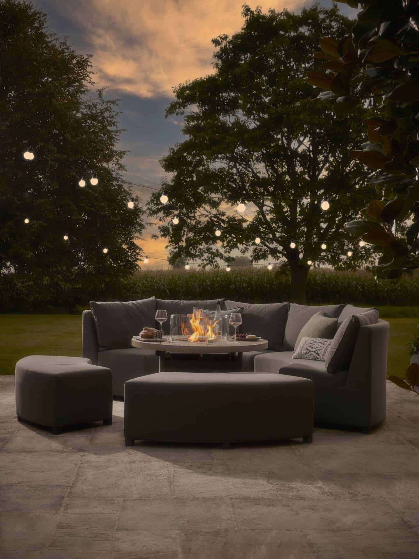 A cosy seating area in a large garden with firepit