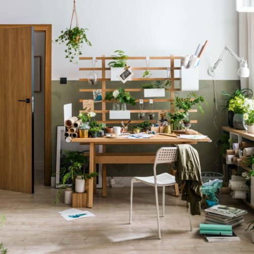 productive home office with wooden desk and green walls