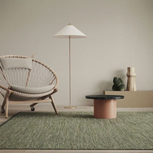 A living room scene featuring chair, table and lamp inspired by nature to create a biophilic home