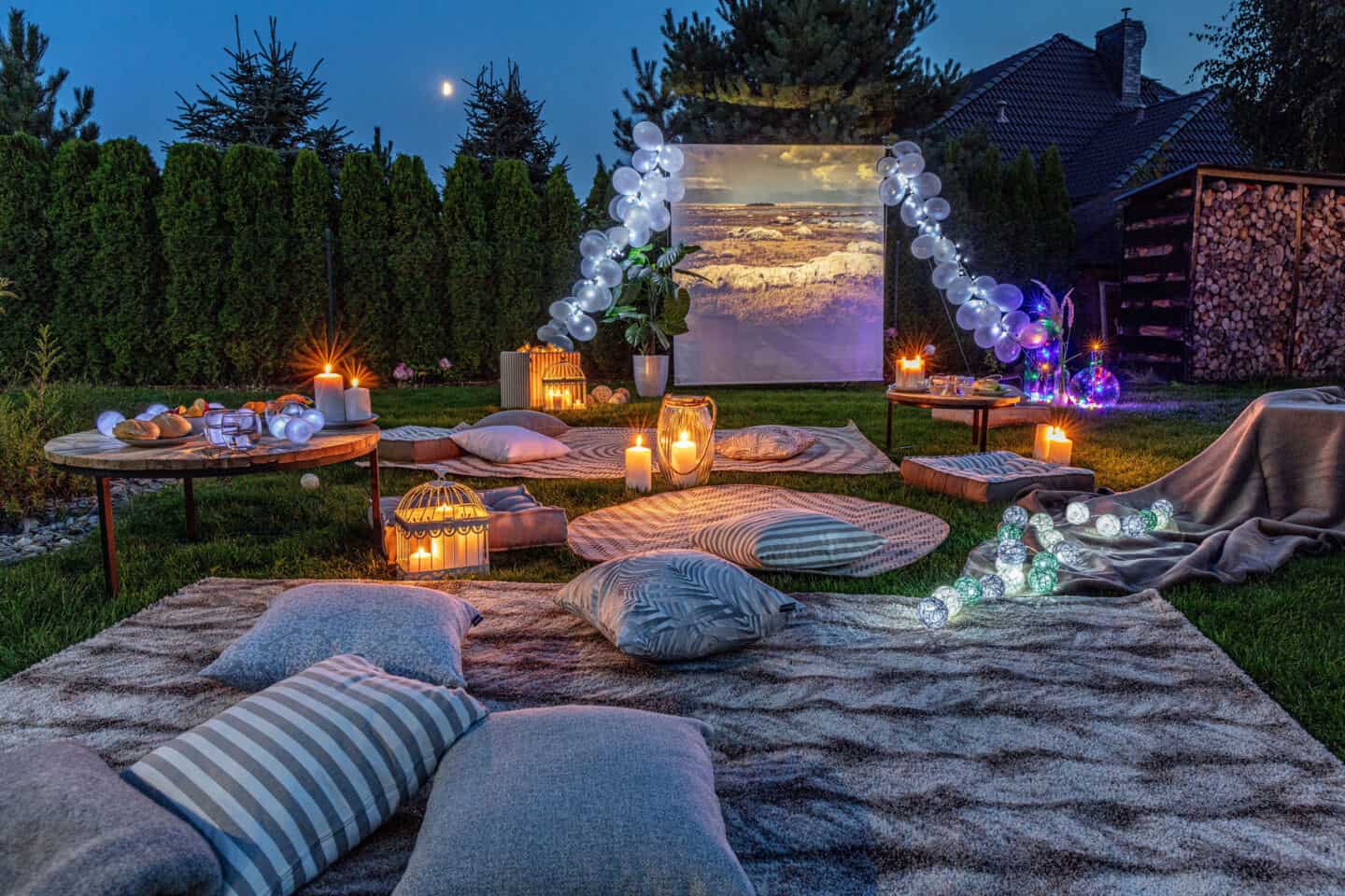 An outdoor cinema set up at night