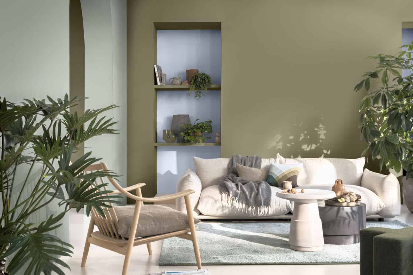 A living room with recessed shelving painted in Dulux Colour of the Year 2022 Bright Skies