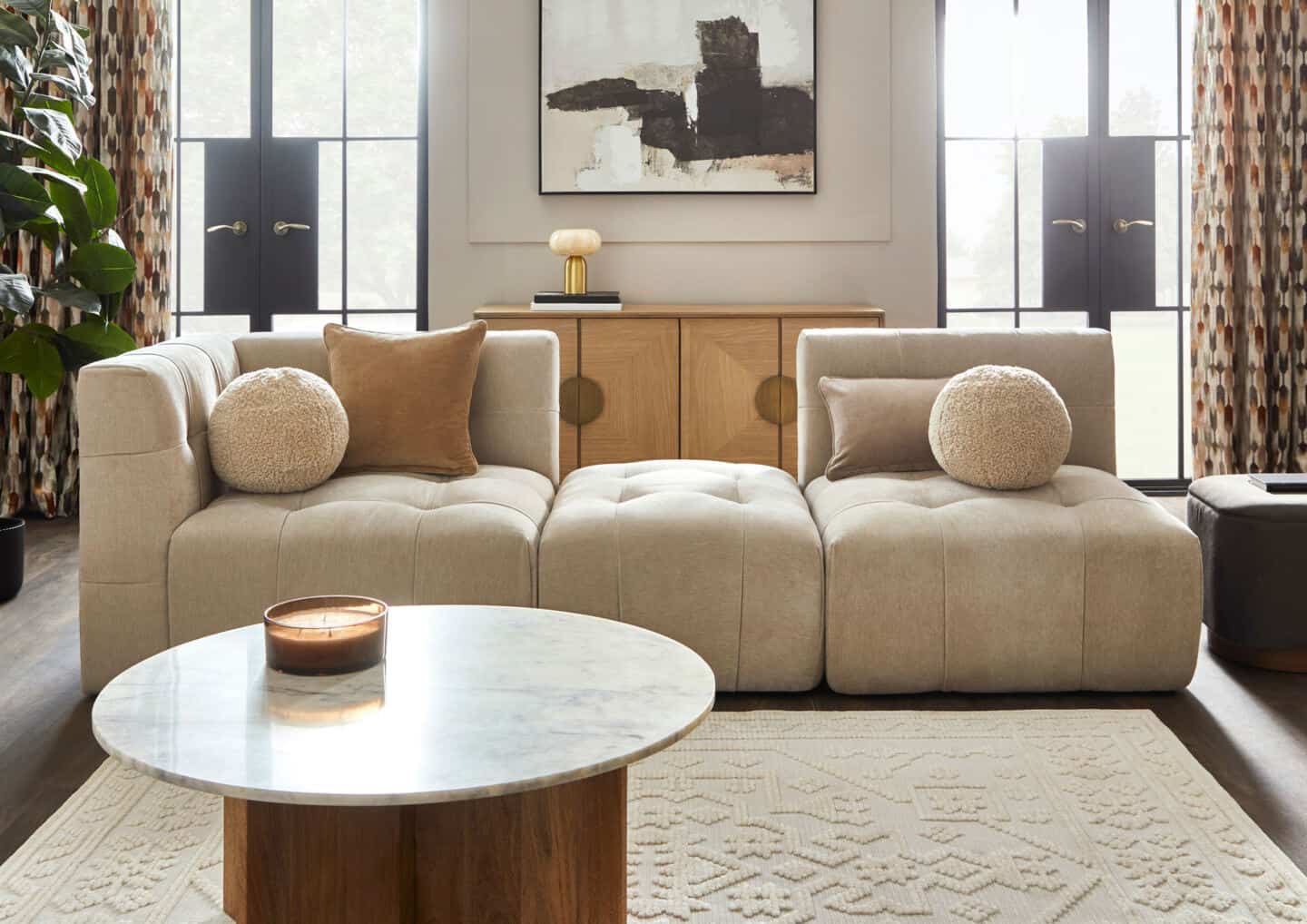 A modern minimalist Japandi-style living room in neutral colours feature natural materials.