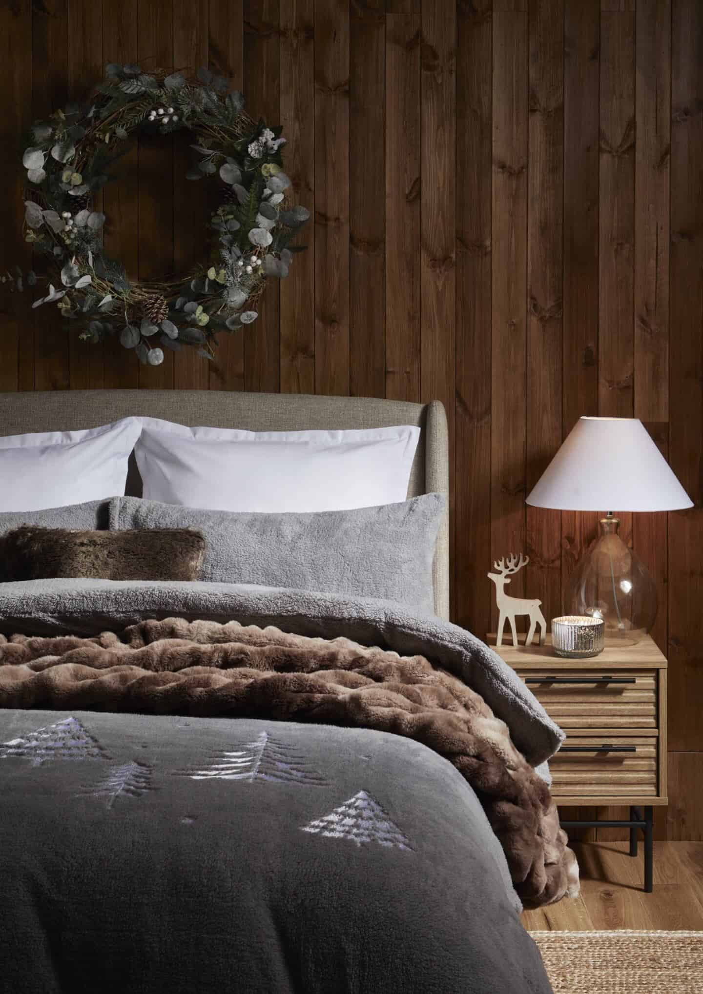 A cosy bedroom with lots of teddy bear blankets.