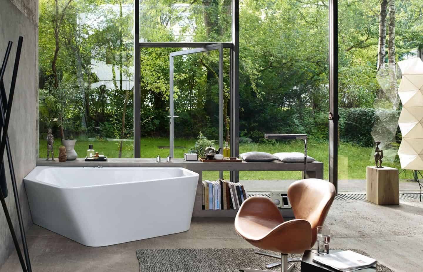 Luxury bathroom brand Duravit showcases the Paiova 5 bathtub in front of a large wall of glass