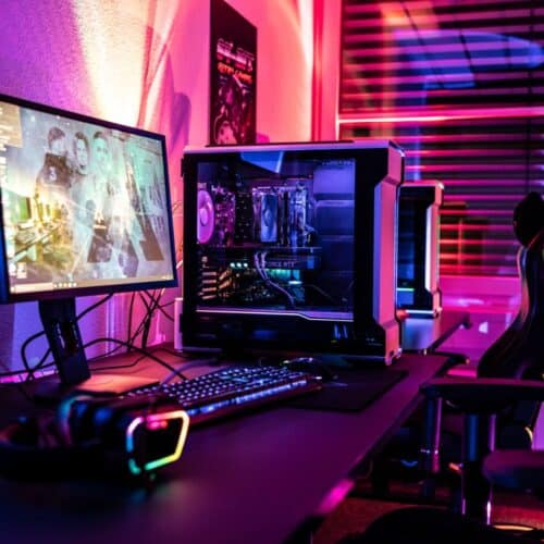 A gaming room with colourful LED Lights