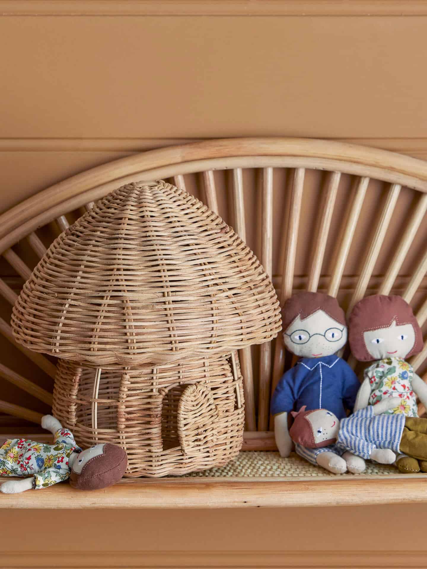 A mushroom shaped storage basket made of rattan