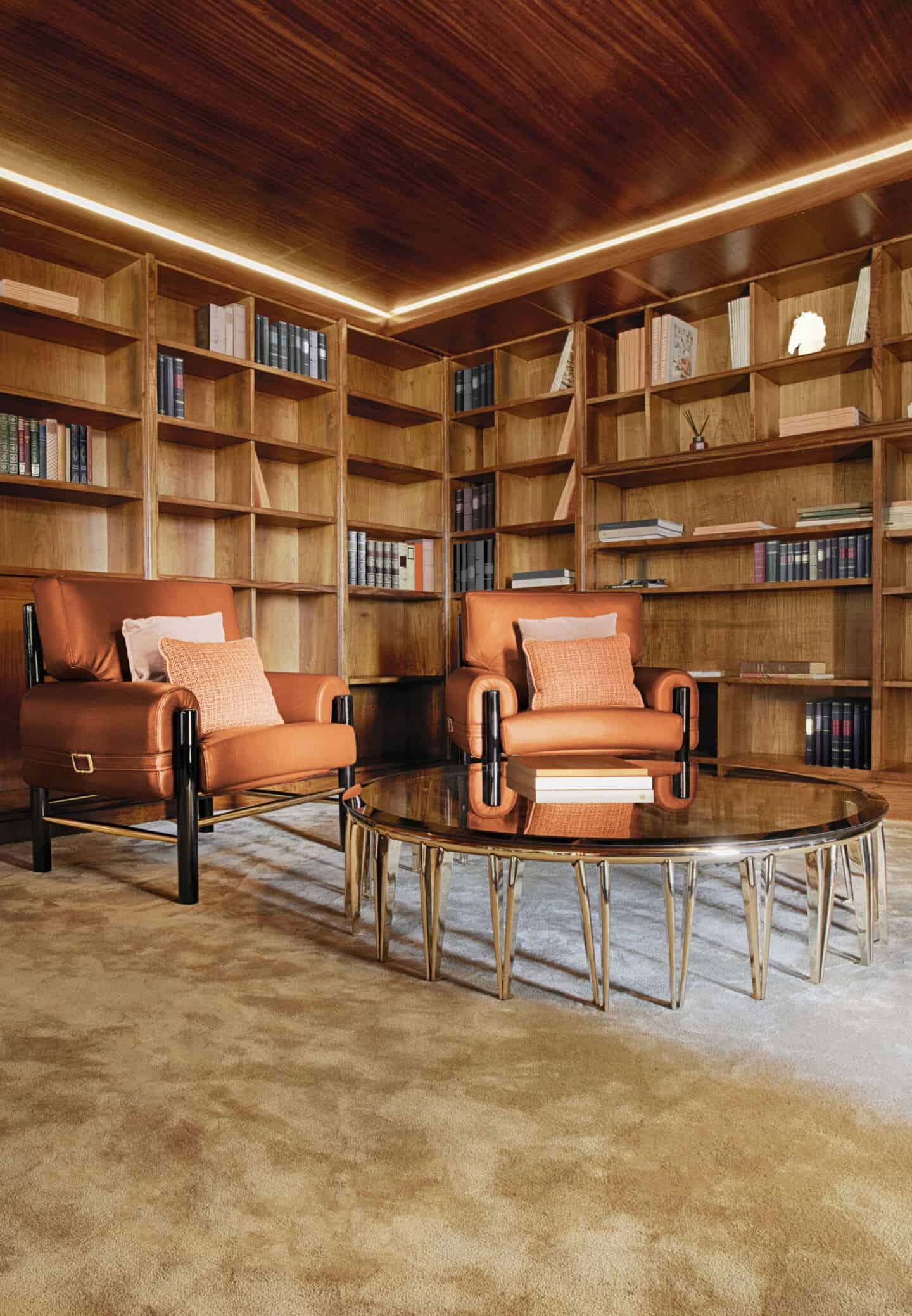 A home library with wall to wall wooden shelving and a wooden ceiling