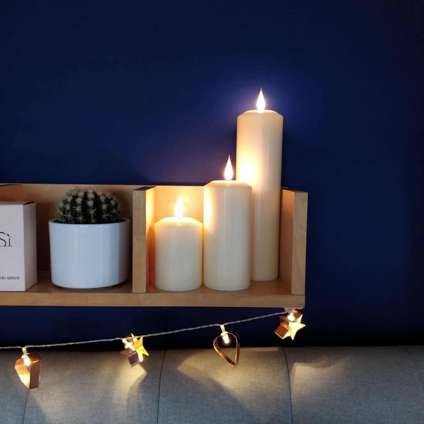 Realistic LED candles from Candled on a bedroom shelf 5