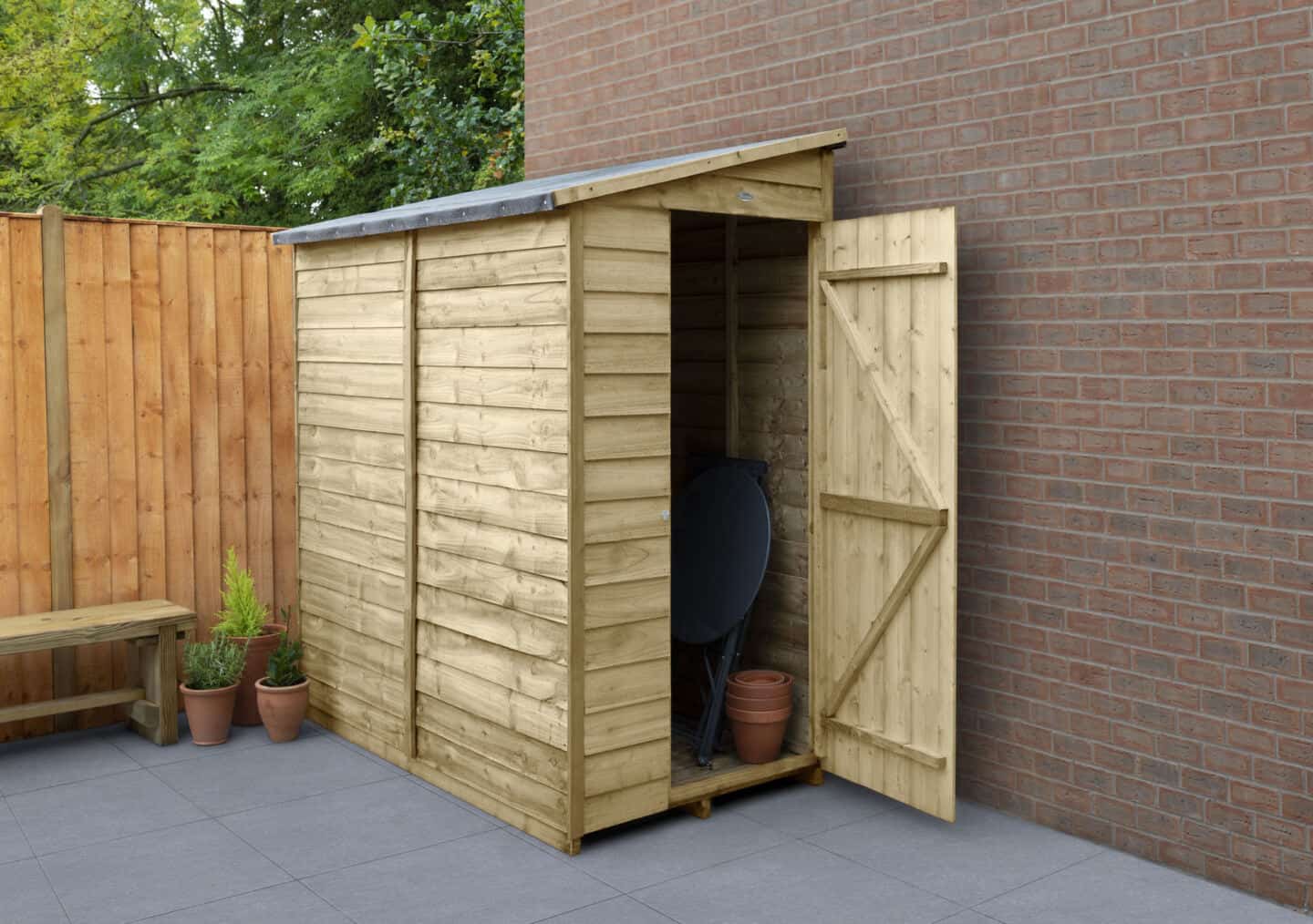 Half garden shed on a patio against the wall