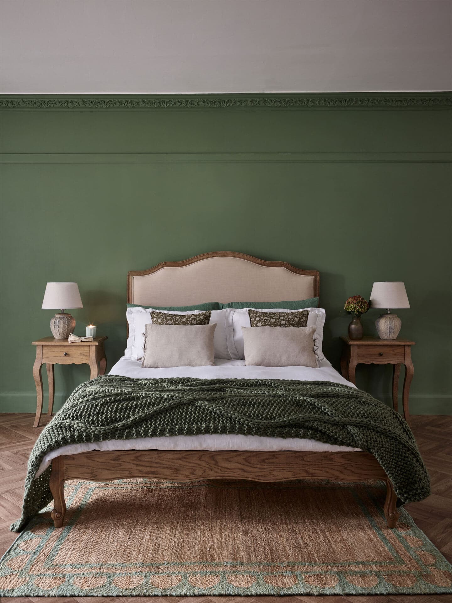 Green bedroom featuring earthy neutral colours, French-style furniture and lots of natural materials and textures