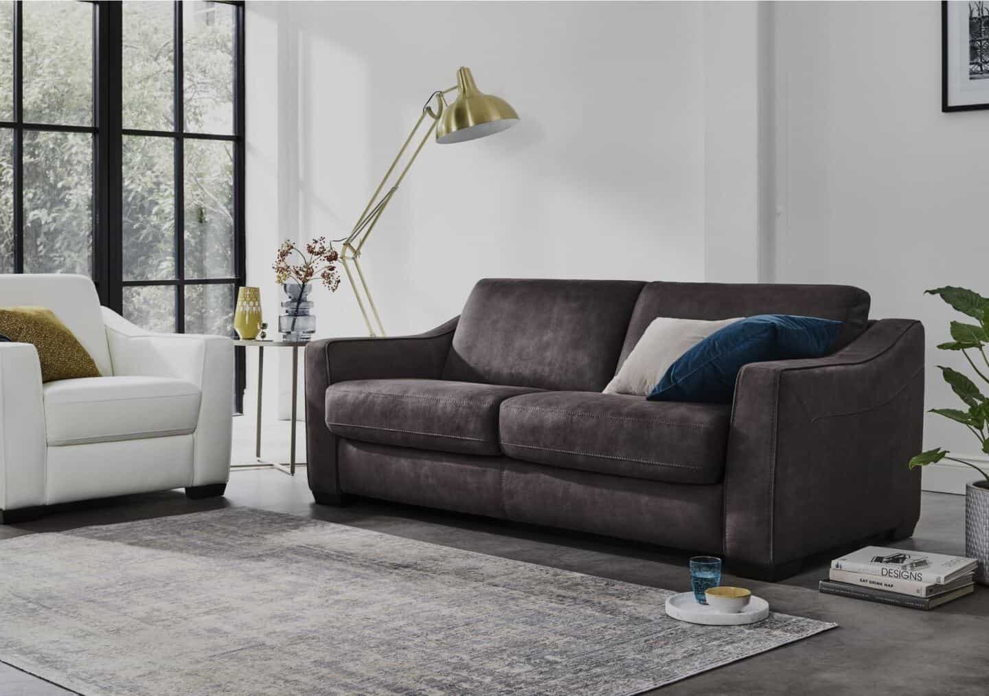 A grey Lawson style sofa in a modern livingroom next to a Lawson style armchair