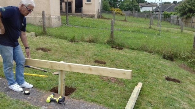 Garden makeover building the raised decking frame