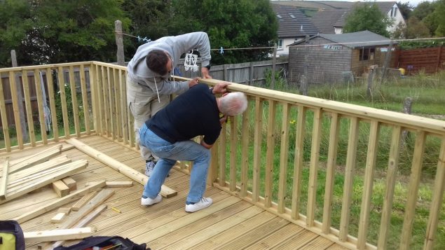 Garden Makeover installing the decking balustrade handrail