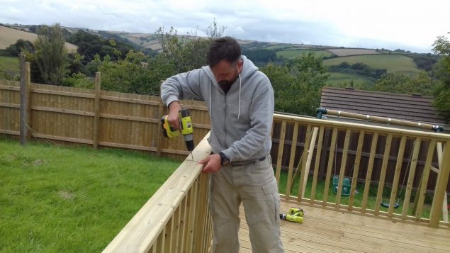 Garden Makeover installing the handrail of the decking baulstrade by Richard Burbidge