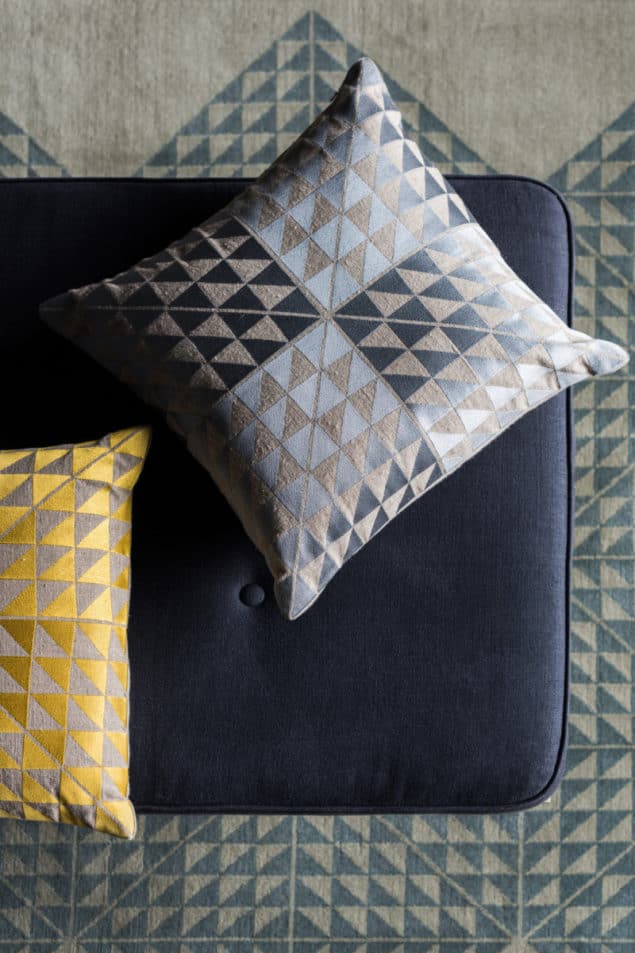 Yellow and grey geometric cushions by Niki Jones