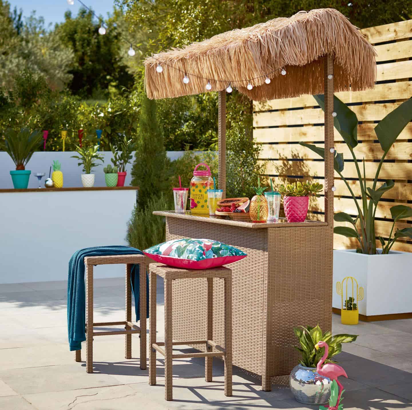 A tiki bar adds instant holiday vibes to your summer staycation in your garden