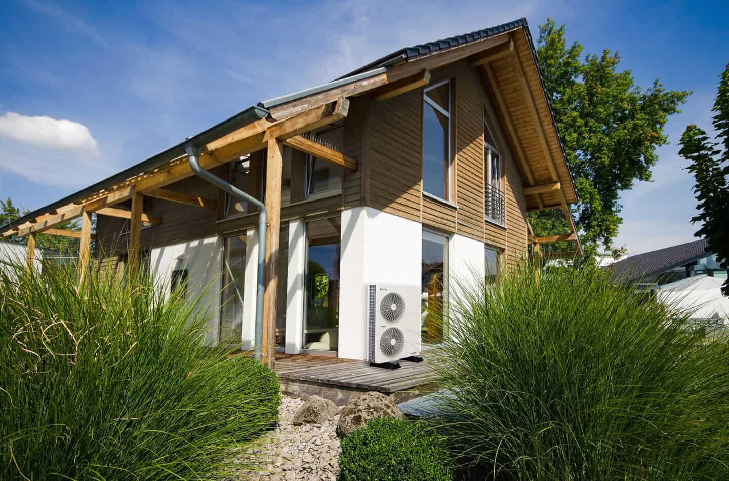 A house with a heat pump installed outside for heating