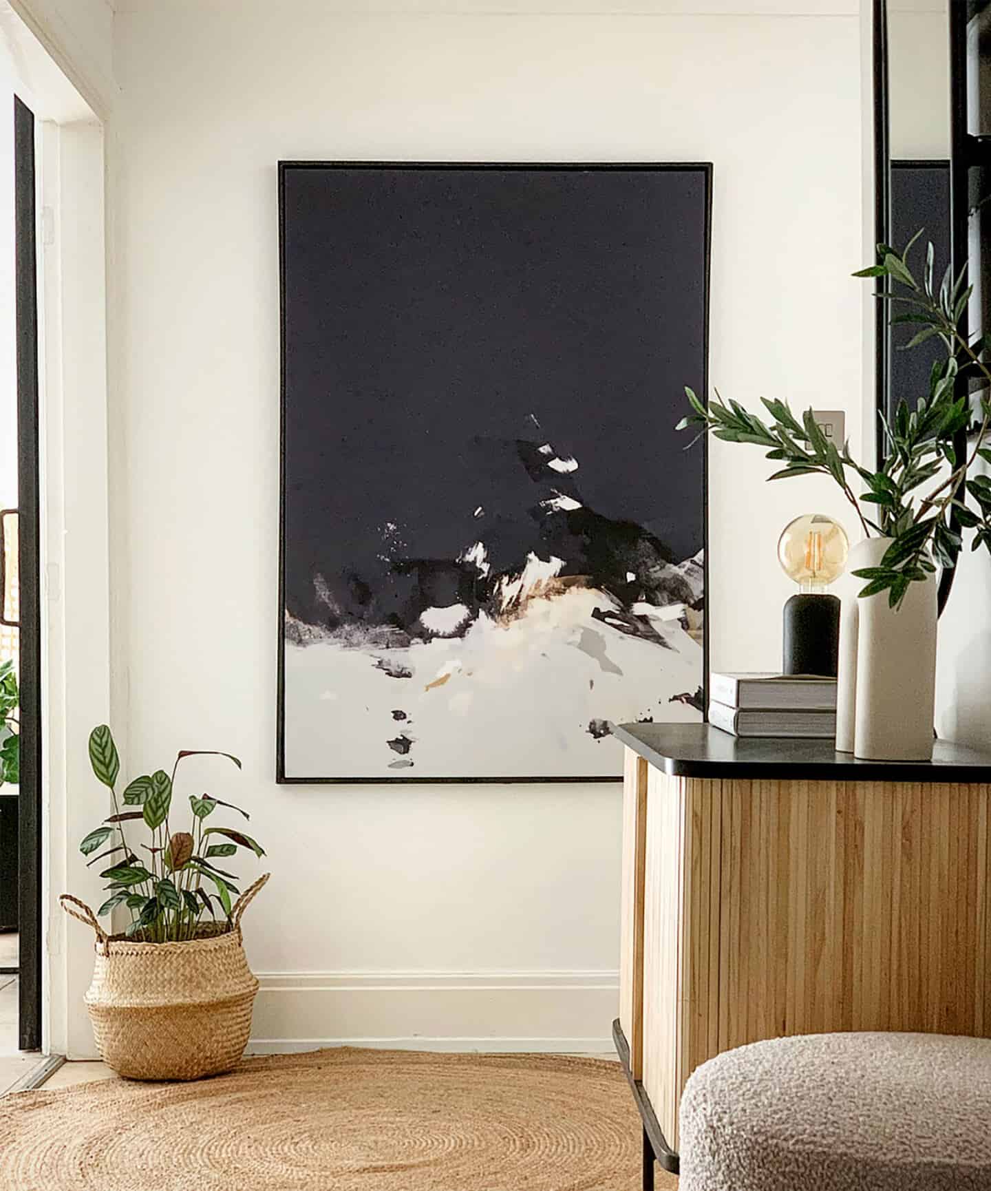 Abstract Artwork in a hallway created the feel of a luxurious home