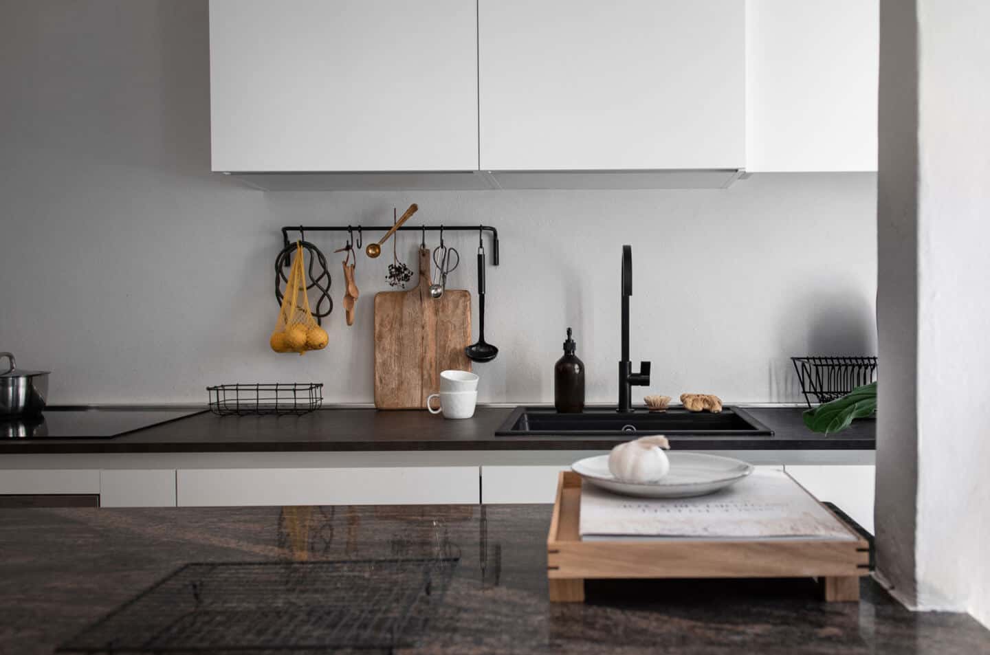 6 Easy Ways to Spruce Up Your Kitchen on a Budget - Image of a kitchen sink with cabinets above