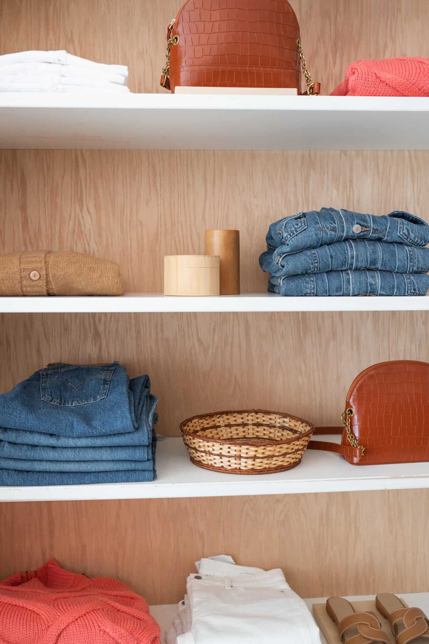 Clothes neatly folded and stored on shelves