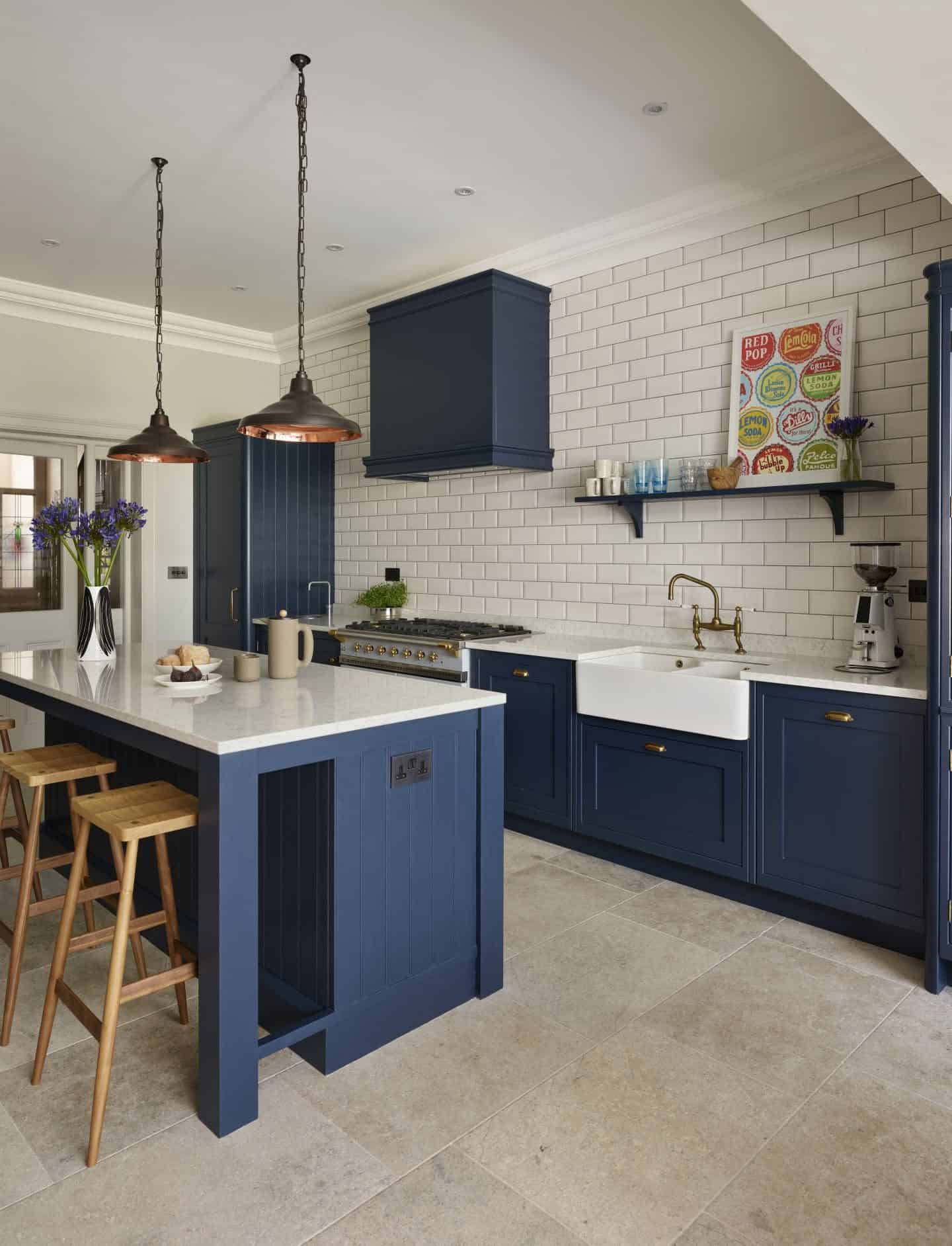 This Holkham inspired kitchen by Davonport is hand-painted using Bond Street by Mylands, set against the crisp backdrop of white worktops and metro tiles