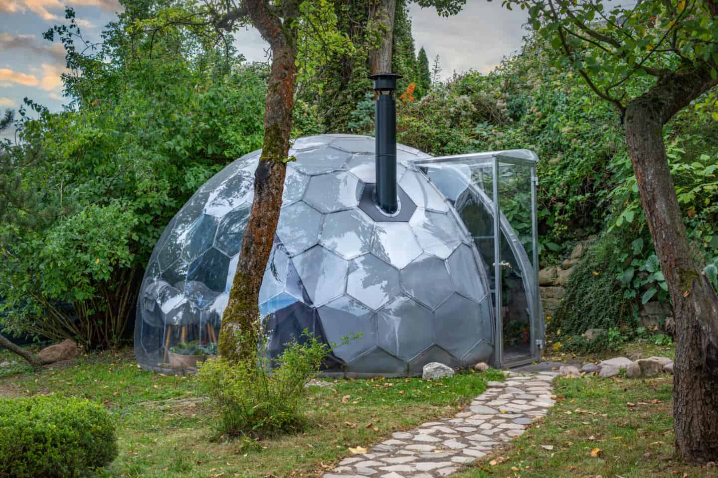 A heated garden dome with a chimney coming out of the top