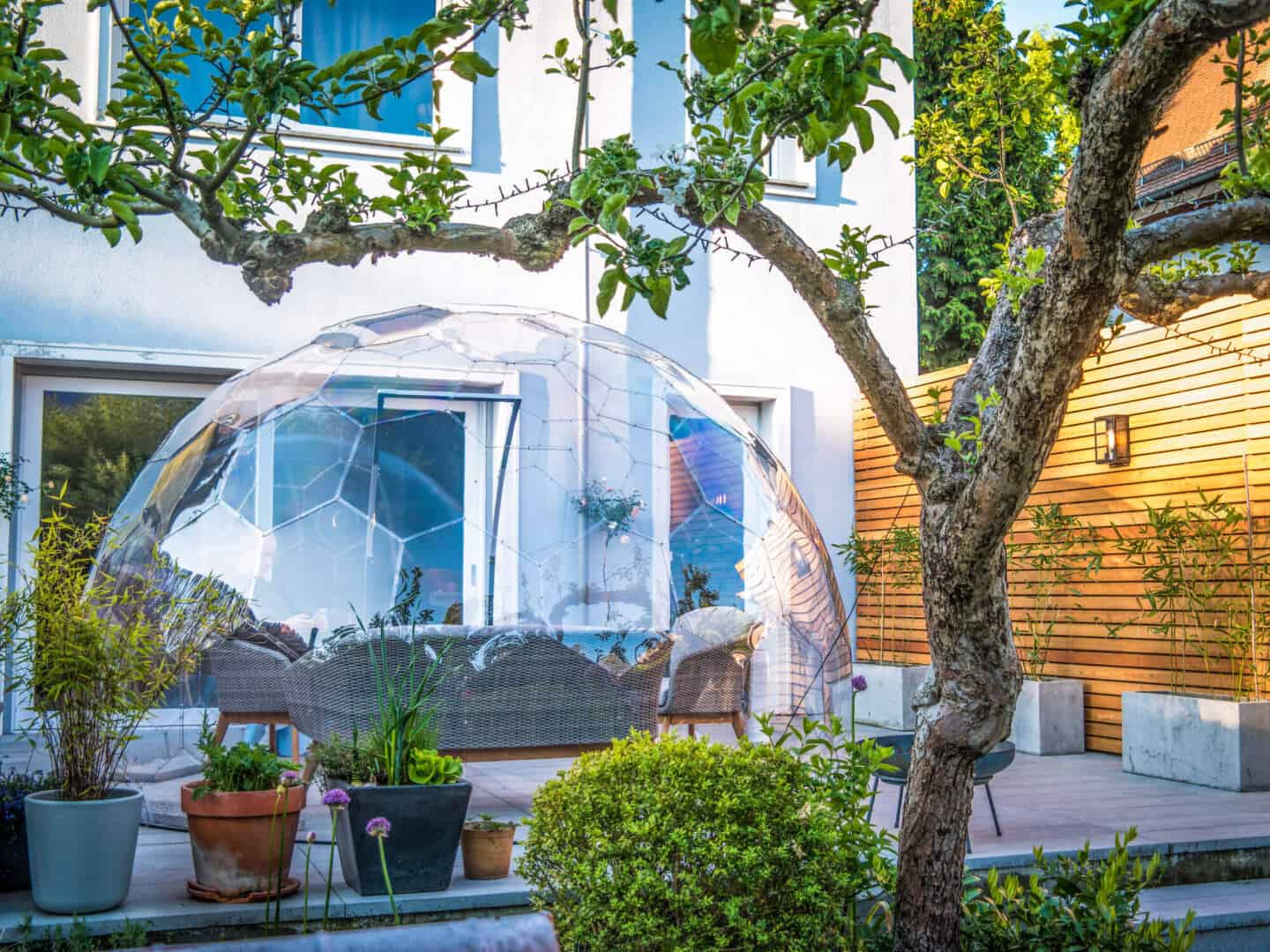 Garden furniture inside a geodesic dome in a patio