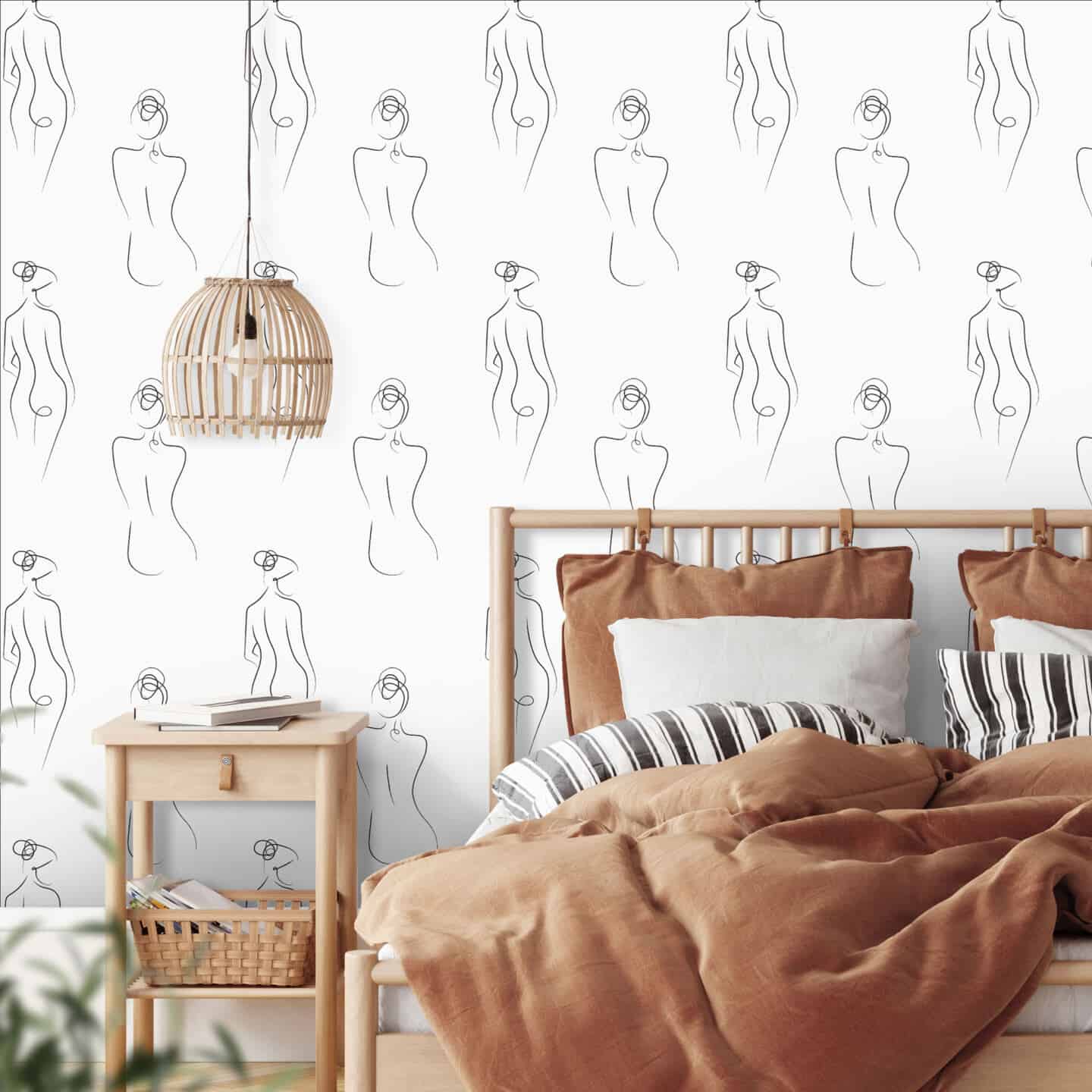 White wallpaper in a bedroom  featuring abstract line drawings of the female form