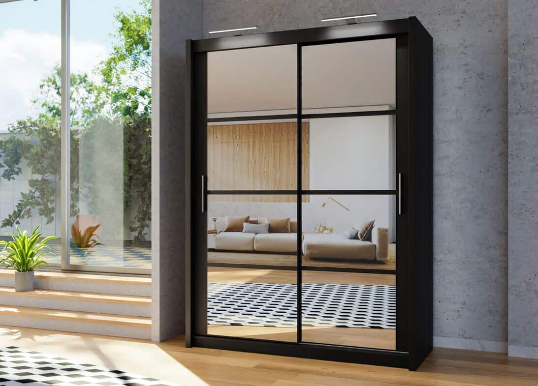 A large black wardrobe with mirror sliding doors in a modern scandi-style living room.