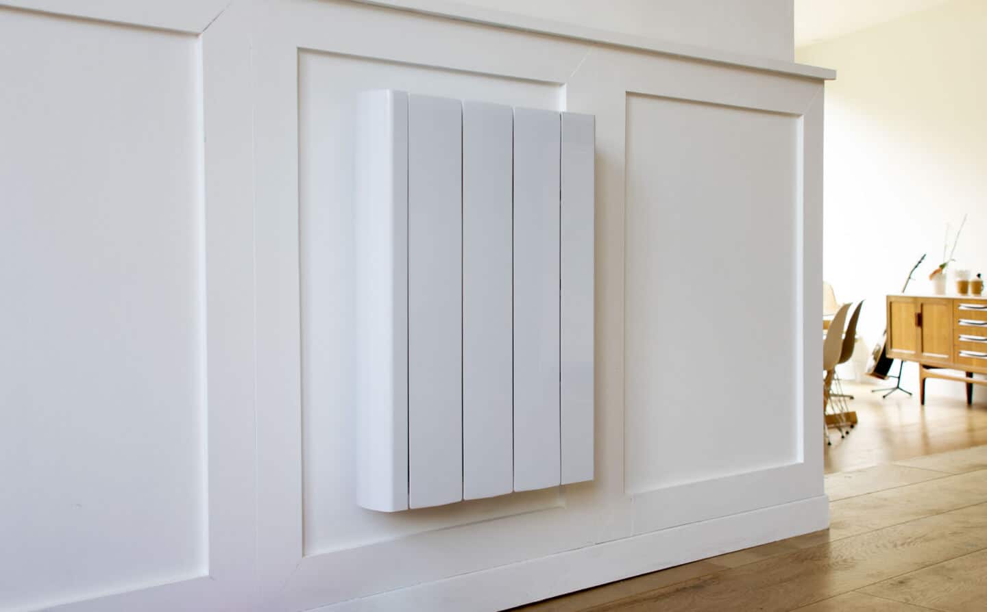 The Ecostrad iQ Ceramic radiator mounted on a white wall